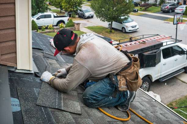 Professional Roof Replacement technician working in Estero, FL